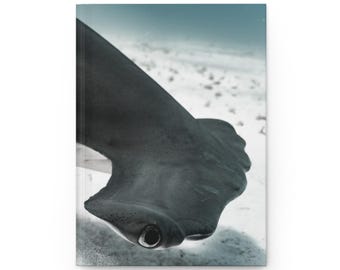 May include: A journal featuring a close-up image of a hammerhead shark underwater. The shark's distinctive head shape and eye are visible, with a grayscale color palette. The background shows a sandy ocean floor.