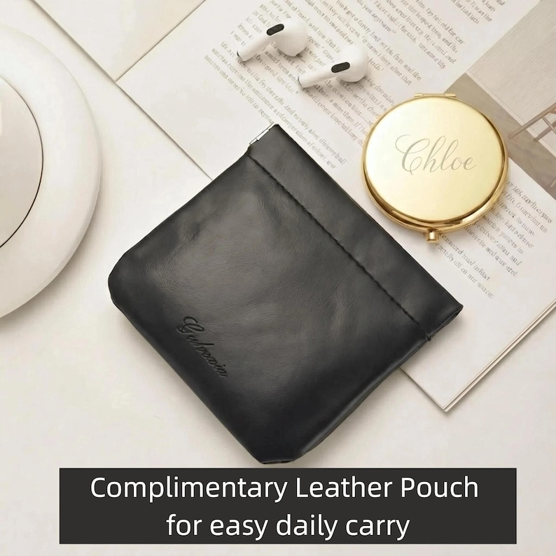 May include: A black leather pouch with the word "Galbacia" embossed on the front. A gold compact mirror with the name "Chloe" engraved on it and a pair of white wireless earbuds are also visible. The text "COMPLIMENTARY LEATHER POUCH for easy daily carry" is at the bottom.