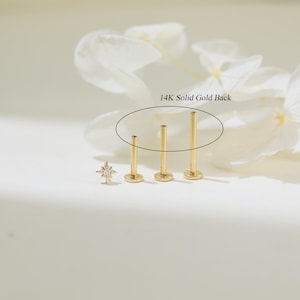 May include: Three gold 14K solid gold backings for a stud earring. The backings are different lengths.  14K Solid Gold Back.
