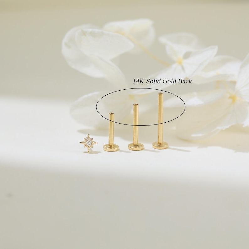 May include: Three gold 14K solid gold backings for a stud earring. The backings are different lengths.  14K Solid Gold Back.