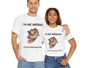May include: Two white t-shirts with a cat peeking out of a hole in the fabric. The text on the shirts reads "I'm not antisocial, I'm just selectively friendly".