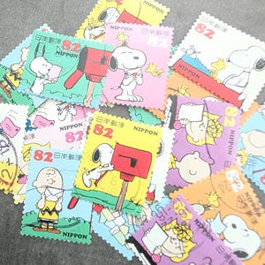 20x Japanese used postage stamps, off-paper, Snoopy and the Peanuts gang, crafting, collecting, Junk Journal, Charles Schulz