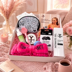 May include: A gift box containing a white and black patterned cosmetic bag, a pink facial cleansing brush, a green foaming cleanser, a Feel Fine candle, a nose strip box, a Feel Fine intimate hygiene gel, and a bright pink fuzzy headband with OMG text.