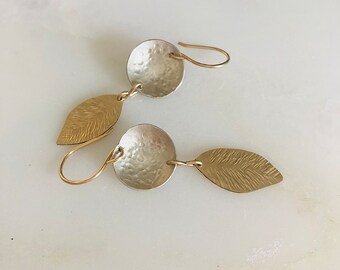 silver and gold disc and feather earrings