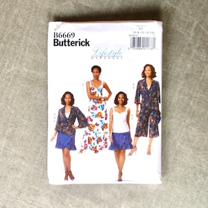 May include: A sewing pattern for women's clothing, featuring four different styles. The pattern is from Butterick and is labeled B6669. The pattern includes a floral maxi dress, a white top with a blue denim skirt, a blue denim skirt with a floral print top, and a blue jumpsuit with a long sleeve jacket.