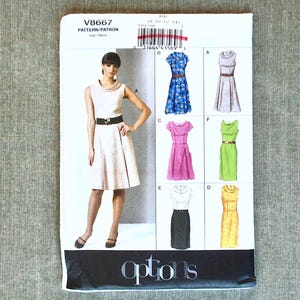 May include: A sewing pattern titled V8667, featuring a woman modeling a dress with a wide belt. The pattern includes illustrations of various dress styles in different colors. The word "options" is printed at the bottom.