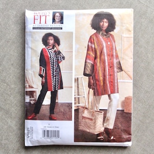 May include: A Vogue Patterns sewing pattern, V1621, featuring a woman in a long coat. The coat is shown in two different designs, one with a black, white, and red pattern and the other with a striped pattern. The pattern includes the text "TODAY'S FIT".