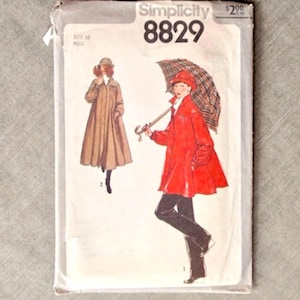 May include: A Simplicity 8829 sewing pattern envelope for size 10. The front features illustrations of two outfits: a long tan coat with a matching hat, and a bright red jacket with dark trousers, paired with a plaid umbrella. The text includes Simplicity 8829.