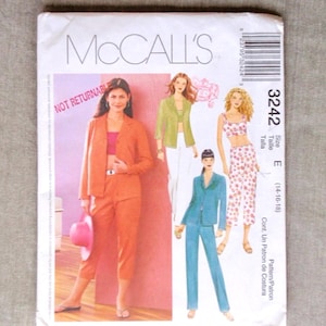 May include: A McCall's 3242 sewing pattern envelope featuring illustrations of four different outfits including a blazer and pants set, a jacket with trousers, and a crop top with patterned pants. The text includes the brand name and size E 14-16-18.