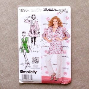 May include: A Simplicity sewing pattern, style 1896A, featuring illustrations of women's clothing designs. The pattern includes the text "SUEDE says", "FLIRTY", and "EDGY". The pattern is for sizes XXS-XXL.