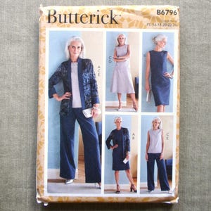 May include: A Butterick sewing pattern envelope featuring images of women's fashion designs. The envelope displays a variety of outfits, including a pantsuit, dresses, and a skirt set. The color palette includes shades of blue and white.