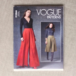 May include: Vogue Patterns R10866 sewing pattern envelope featuring two garment options. One view shows a black long-sleeve wrap top with red wide-leg trousers. The second view shows a dark gray turtleneck top with a khaki midi-length skirt.