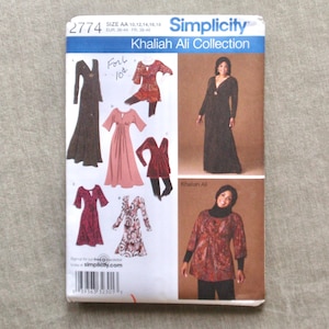 May include: A Simplicity sewing pattern featuring the Khaliah Ali Collection. The pattern includes illustrations of various dress designs, with sizes AA 10, 12, 14, 16, and 18. The cover is white and blue with the Simplicity logo.