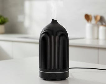 Difusor de aroma eléctrico de plástico negro con nervaduras