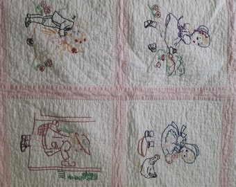 Antique embroidered baby quilt