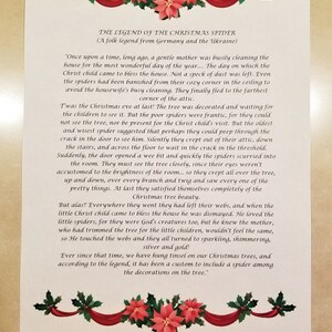 May include: A printed page with the text "THE LEGEND OF THE CHRISTMAS SPIDER" and a folk tale about spiders and Christmas trees. The text is surrounded by a decorative border of red ribbons, green holly, and red poinsettias.