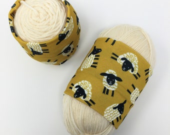 Standard Yarn Hugger: Silly sheep on yellow knitting crochet notion