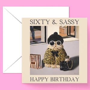May include: A birthday card featuring a cartoon cat wearing a leopard print coat, sunglasses, and a beret. The cat is holding a shopping bag and a purse. The card says "Sixty & Sassy" and "Happy Birthday".