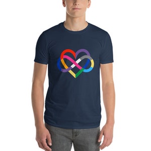 May include: A navy blue t-shirt featuring a colourful infinity symbol in the shape of a heart. The symbol is made up of different colours, including red, orange, yellow, green, blue, purple, and white.