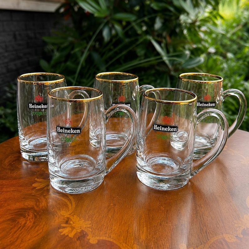 Rare Heineken breweriana glasses featuring classic brewery emblem