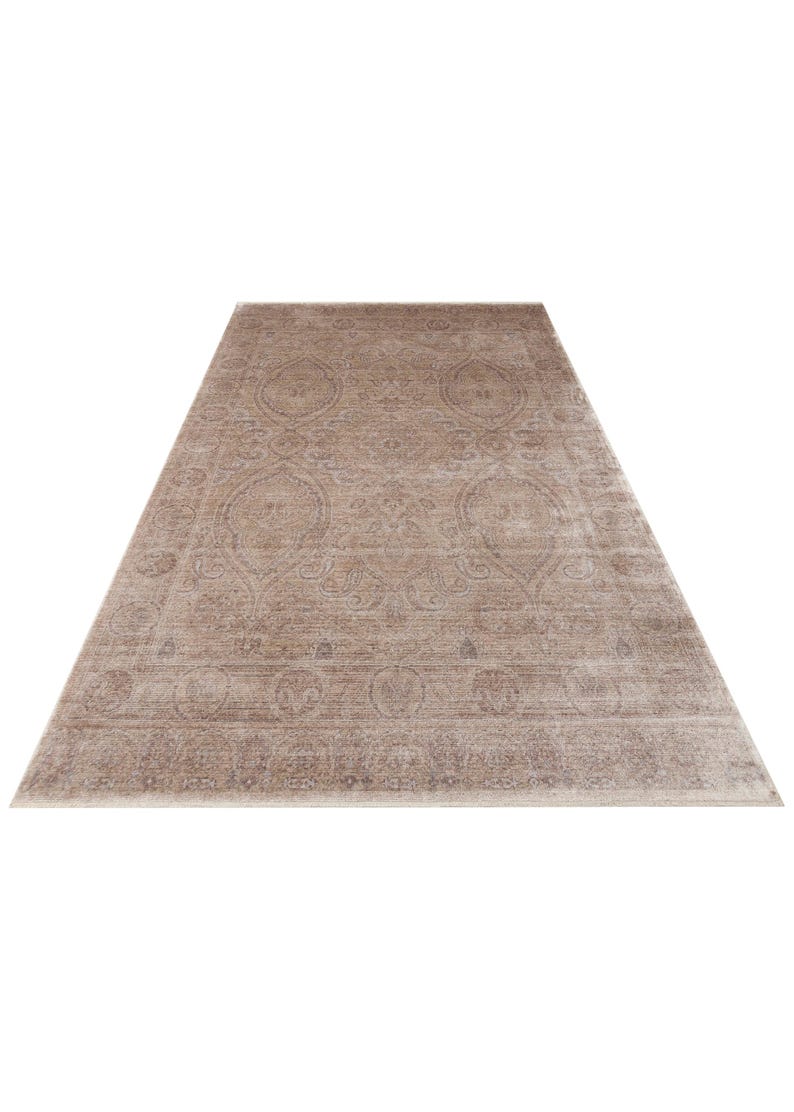 May include: A rectangular area rug featuring a faded, distressed beige and light brown color palette. The surface displays an intricate, symmetrical pattern of ornate floral medallions and scrolling vine motifs across the entire field.