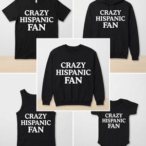 Può includere: Diversi capi d'abbigliamento neri con la scritta bianca "CRAZY HISPANIC FAN". Include una t-shirt, una felpa con cappuccio, una felpa, una canotta e un body per neonati. Presentato su sfondo chiaro.