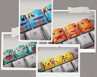 May include: A collage of photos featuring custom keycaps with various Pokémon character designs. The keycaps are in the shape of characters like Squirtle, Charmander, Bulbasaur, and Pikachu, and are placed on a white keyboard.