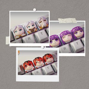 May include: A set of three ceramic mugs with a speckled, matte finish. The mugs are in shades of cream, light gray, and dark gray. Each mug has a simple, minimalist design and a rounded handle.