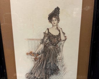 May include: An antique framed print of a woman in a long dress and hat, seated on a chair. The artwork is in shades of brown, black, and red, with a delicate, sketched style. The woman holds flowers, and the print is signed.