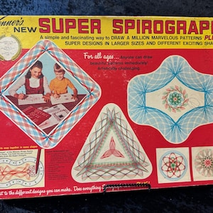 May include: Vintage Kenner's Super Spirograph box. The red box features the product name and illustrations of patterns. The text reads: "A simple and fascinating way to draw a million marvelous patterns plus." It also includes the text: "For all ages... Anyone can draw beautiful patterns immediately!"