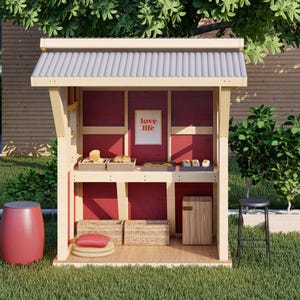 Puede incluir: Un peque&ntilde;o puesto de madera con un exterior rojo y un techo de metal corrugado. El puesto tiene estantes con productos horneados y un letrero que dice "love life".