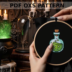 May include: A cross-stitch pattern of a potion bottle with green liquid, held in a wooden embroidery hoop. The text "PDF OXS PATTERN" is at the top. The background includes a cauldron, candles, and books.