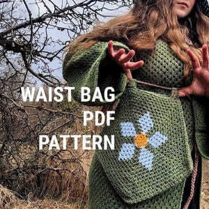 May include: A green crochet waist bag with a blue and yellow flower design. The bag is part of a PDF pattern, as indicated by the text on the image. The image also features a person wearing a green hooded cloak and a dragon in the sky.