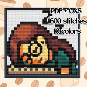 May include: Cross-stitch pattern in a black frame featuring a pixelated image of a person with brown hair, glasses, and a green shirt, resting on a table. The text "PDF+OXS", "1600 stitches", and "10 colors" are displayed.