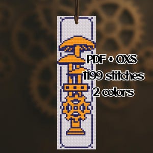 May include: A bookmark with a cross-stitch design featuring a stylized gear and mushroom in shades of orange and blue. The bookmark has a white background with a blue border and a brown string. Text on the bookmark reads "PDF + OXS", "1199 stitches", and "2 colors".