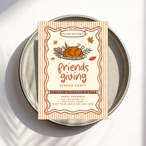 May include: A Friendsgiving dinner party invitation on a gray plate. The invitation features a roasted turkey illustration and the words "friends giving" in orange script. Details include the date, time, and location.