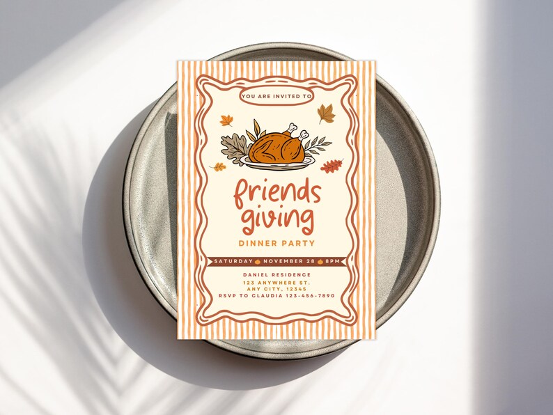 May include: A Friendsgiving dinner party invitation on a gray plate. The invitation features a roasted turkey illustration and the words "friends giving" in orange script. Details include the date, time, and location.