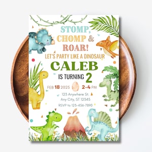 May include: A colorful dinosaur-themed birthday party invitation for Caleb's 2nd birthday. The invitation features a green, yellow, and blue dinosaur with a volcano and the text "Stomp, Chomp & Roar! Let's party like a dinosaur. Caleb is turning 2. Feb 18 2025 2-4 PM 123 Anywhere St. Any City, ST 12345 RSVP to 123-456-7890"