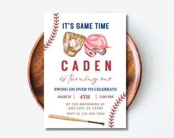 May include: Baseball-themed birthday party invitation with red, white, and blue colors. It says "It's Game Time" and "Caden is turning one". The invitation includes a baseball glove, baseball, and baseball helmet.