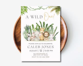 Könnte beinhalten: Eine weiße Einladung mit grünem Laub und Dschungeltieren. Der Text lautet "A WILD One!" und "Please join us to celebrate Caleb Jones August 12 12:00 PM 123 Anywhere St. Any City, ST 12345 RSVP to 123-456-7890".