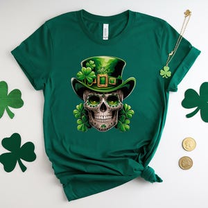 May include: Green t-shirt with a skull wearing a green leprechaun hat and holding a shamrock. The skull has green eyes and a green beard. The shirt is a great choice for St. Patrick's Day.