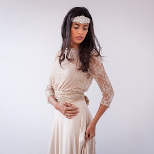 Bohemian lace wedding dress with sleeves in light golden beige with wrap bodice and A-line skirt