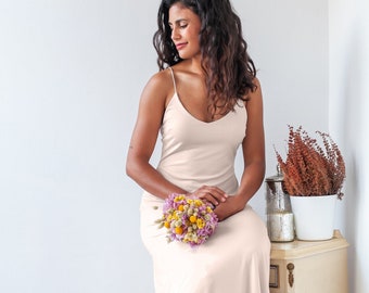 Simple and sleek champagne low cut slip wedding dress with spaghetti straps