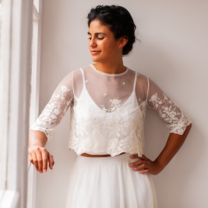 Romantic embroidered bridal top in scalloped tulle with crew neck and three quarter sleeves