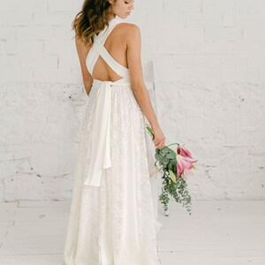 long detachable lace train over a white wedding dress