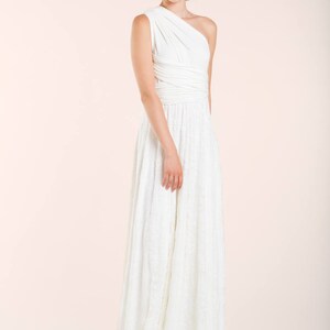 Model wearing a simple wedding dress in a relaxed way
