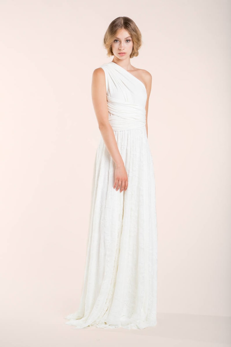 Model wearing a simple wedding dress in a relaxed way