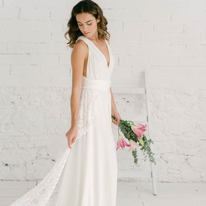 ivory wedding gown with a lace detachable train