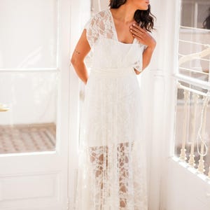 This time the woman is wearing the tube dress with an ivory lace overdress. She is looking outside, with an arm hidden on her back.