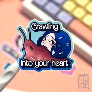 a gradient light blue + blue background sticker depicting Slug Girl from the manga by Junji Ito,  with the "Crawling into your heart" writing below.